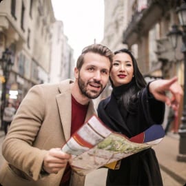 people with map searching for a route in a city